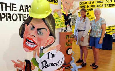 Save the Mary campaigners Glenda Pickersgill and Jenny Mengel compare the contrasting images of Anna Bligh and Peter Garrett at Gympie Regional Gallery . Save the Mary campaigners Glenda Pickersgill and Jenny Mengel compare the contrasting images of Anna Bligh and Peter Garrett at Gympie Regional Gallery .